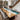 Large poplar resin dining table with live edge wood details and realistic ocean-inspired resin design creating a stunning centerpiece for a contemporary dining room -- BespokeTableCo