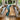 Modern dining room featuring a custom epoxy table made from poplar wood, combining natural timber textures with a flowing blue resin river centerpiece ---- BespokeTableCo