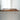 A black walnut resin dining table with natural black walnut wood grain and refined epoxy details for a durable solid wood dining table surface - BespokeTableCo