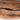 Close-up of resin black walnut epoxy dining table detail showing organic wood texture, premium finish, and custom epoxy table craftsmanship - BeSpokeTableCo