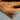 Detailed view of Burl Cedar resin tabletop with epoxy table finish, highlighting the contrast between organic timber texture and smooth resin inlay for a bar counter - BespokeTableCo