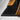 Close-up detail of custom epoxy resin black walnut conference table showing live edge walnut grain, glossy resin finish, and premium craftsmanship for modern conference table design - BespokeTableCo