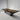 Exhibition display of custom epoxy resin black walnut conference table featuring live edge wood character and full glossy resin finish for elegant conference room tables - BespokeTableCo