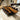 Custom epoxy resin black walnut conference table with live edge walnut slabs and polished resin surface styled in a contemporary meeting space, combining craftsmanship with modern conference table design - BespokeTableCo