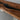 Custom Black Walnut Epoxy Resin Conference Table detail showcasing integrated power outlet functionality, elegant black walnut wood surface, and modern conference room tables features - BespokeTableCo
