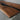 Custom Black Walnut Epoxy Resin Conference Table detail highlighting straight edge craftsmanship, natural black walnut wood texture, and professional conference room tables design - BespokeTableCo