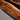 Detailed view of beveled edge design and full glossy finish on custom black walnut epoxy resin table, showcasing high-quality dining table wood materials - BespokeTableCo