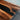 Natural walnut slab detail on custom black walnut epoxy resin table featuring unique grain patterns and resin artistry for a distinctive dining table wood design - BespokeTableCo