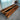 Exhibition display of a custom black walnut epoxy resin table with rich wood tones, smooth resin details, and elegant dining table wood craftsmanship for luxury interiors - BespokeTableCo