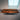 Custom black walnut epoxy resin table display featuring beveled edge craftsmanship and full glossy finish, highlighting the beauty of handcrafted dining table wood design - BespokeTableCo
