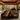 Custom black walnut epoxy resin table with natural walnut grain and glossy resin surface, designed as a premium dining table wood for contemporary residential interiors and upscale dining spaces - BespokeTableCo