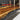 Custom epoxy resin black walnut dining table detail capturing handcrafted edges, premium wood texture, and glossy resin table finishing - BespokeTableCo