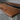 Custom epoxy resin black walnut dining table detail highlighting live edge wood texture and handcrafted epoxy table river details - BespokeTableCo
