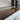 Custom epoxy resin black walnut dining table detail showing rich walnut grain on a wood dining table with a resin table center - BespokeTableCo