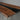Detailed image of black walnut dining room table featuring smooth epoxy resin inlay, live edge contours, and handcrafted top table top craftsmanship - BespokeTableCo