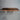 Bespoke epoxy resin black walnut dining room table exhibition highlighting the live edge craftsmanship, glossy resin, and artistic top table top finish - BespokeTableCo