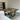 Custom epoxy resin burl cedar dining table displayed with a glossy resin finish and organic wood patterns in a sophisticated dining area - BespokeTableCo