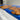 Custom epoxy resin golden camphor kitchen countertops detail showing rich wood slabs for countertops with natural grain and detailed epoxy table inlay - BespokeTableCo