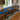 Custom epoxy resin golden camphor kitchen countertops installed in a modern kitchen featuring premium wood slabs for countertops and a handcrafted epoxy table design - BespokeTableCo