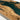 Detailed view of epoxy resin olive dining table surface featuring full glossy coating, refined edges, and organic wood characteristics for a luxury wood dinning table - BespokeTableCo