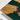 Close-up craftsmanship detail of custom epoxy resin olive dining table with polished resin effects and handcrafted olive wood slabs, creating a one-of-a-kind custom dining tables piece - BespokeTableCo