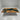 Modern showcase of custom epoxy resin olive dining table with polished resin surface and natural wood grain details, presenting a handcrafted custom dining tables solution - BespokeTableCo