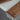 Custom epoxy resin black walnut coffee table detail highlighting the contrast between matte wood texture and glossy resin accents on a handcrafted wood coffee table - BespokeTableCo