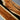 Close-up detail of custom epoxy resin walnut dining table showing beveled edge craftsmanship, natural walnut grain, and glossy epoxy resin table top finish - BespokeTableCo