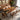 Custom epoxy resin walnut dining table with beveled edge and full glossy finish placed in a modern dining room, featuring natural walnut grain and a premium epoxy resin table top for a luxury solid wood dining table - BespokeTableCo
