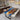 Custom epoxy resin walnut dining table featuring a beveled edge design and full glossy finish, combining natural walnut grain with blue resin accents as a premium solid wood dining table and resin table - BespokeTableCo