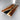 Custom epoxy resin walnut dining table display highlighting the contrast between warm walnut slabs and smooth resin river details, crafted as a modern solid wood dining table with epoxy resin table top - BespokeTableCo
