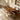 Custom epoxy resin walnut dining table with natural wood patterns and polished resin details styled in a contemporary dining space, designed as a unique solid wood dining table with epoxy resin table top - BespokeTableCo