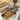 Custom Olive Epoxy Resin Dining Table featuring natural olive wood grain and blue resin details in a modern dining room with solid wood dining table design and epoxy table craftsmanship - BespokeTableCo