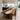 Solid wood dining table with walnut slab and resin inlay, creating a stunning centerpiece for any contemporary dining room - BespokeTableCo