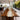 Custom walnut river dining table in a modern luxury dining room, featuring a flowing resin river and premium solid wood dining table craftsmanship - BespokeTableCo