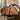 A handcrafted black walnut epoxy table featuring a flowing black resin river and organic wood dining table surface, styled in a contemporary dining room setting - BeSpokeTableCo