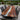A luxury patio setting with a custom Resin Black Walnut Epoxy Resin Dining Table, combining the warmth of a wood dining table with a smooth epoxy design and refined wood table top craftsmanship - BeSpokeTableCo