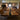 Custom epoxy resin black walnut conference table featuring a glossy resin river center and natural walnut grain in a modern meeting room - BespokeTableCo
