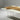 A poplar resin dining table with carefully selected wood grain and epoxy resin finishing, creating a high-quality dining room table for modern interiors - BespokeTableCo