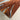 Close-up detail of Resin Black Walnut Epoxy Resin Dining Table showing the natural grain of the wood dining table and smooth epoxy accents on the wood table top - BeSpokeTableCo