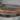 Detailed view of wooden coffee table surface with walnut texture and transparent epoxy resin craftsmanship - BeSpokeTableCo
