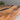 Detailed black walnut epoxy resin dining table surface featuring natural walnut patterns and smooth epoxy table river inlay - BeSpokeTableCo