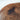 Macro detail of a black walnut resin dining table featuring natural black walnut wood grain, polished resin edges, and handcrafted solid wood dining table construction - BespokeTableCo