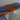 Walnut epoxy resin dining table showcasing a premium walnut dining table surface with rich wood grain patterns and a vibrant resin river design - BeSpokeTableCo