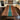 Custom black walnut wood top table kitchen island countertop with flowing blue resin inlay, creating a natural centerpiece in a contemporary kitchen space - BespokeTableCo