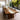 Walnut epoxy dining table in a bright modern dining room, where natural grain meets flowing resin for a one-of-a-kind look - BespokeTableCo