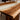 Selecting premium Black Walnut slabs for a custom river table. Handcrafted solid wood dining table with black walnut and resin river, designed to anchor formal dining rooms and open-concept spaces alike - BespokeTableCo