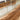 Statement walnut river dining table with a live edge solid wood dining table top, positioned in a sunlit modern dining room where wood and resin become the focal point of the space - BespokeTableCo